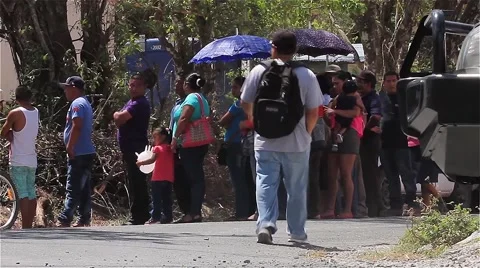 Lines stretching outside of a large food drive in Panama (2) Stock Footage 63394056