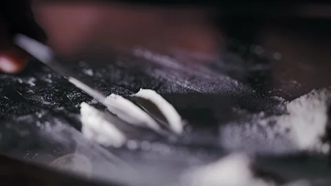 Lines of White Powder on Glass Table Symbolizing Global Underground Economy Flow Stock Footage 319059677