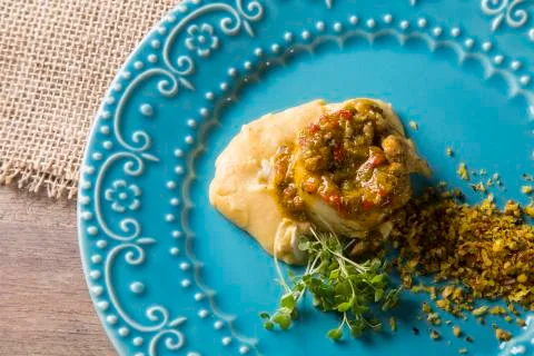 Linguado fish with mashed banana from the ground and farofa Stock Photos