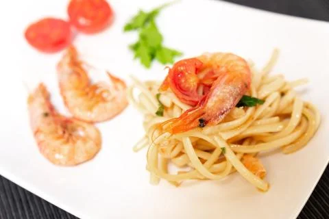 Linguine with shrimps and cherry tomatoes. The shrimps of the Mediterranean a Stock Photos