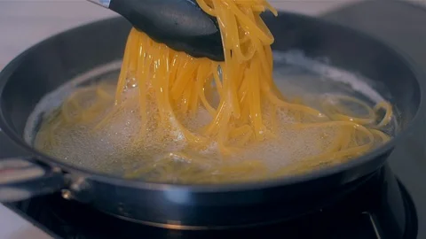 Linguines are cooked in a pan Stock Footage 111671355