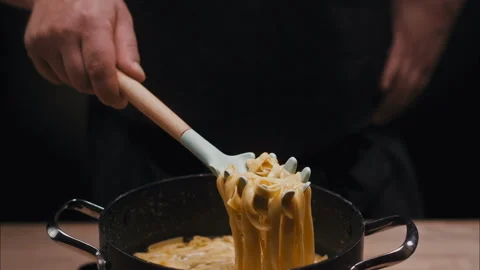 Linguini in a Pot taken with Spoon Stock Footage 254908992