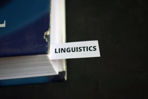 Linguistics Concept Bookmark Inserted in Book Representing Language, Commun.. 스톡 사진