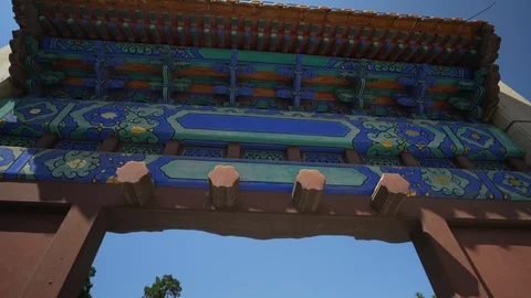 Lingxing Gate amidst trees against blue sky - Beijing, China Stock Footage 117632149