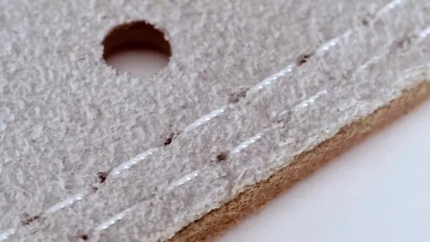 The lining is attached to the leather product with double stitching  Stock Footage 287959354