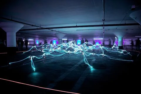 Linked Neon Lights Under White Painted Basement Stock Photos