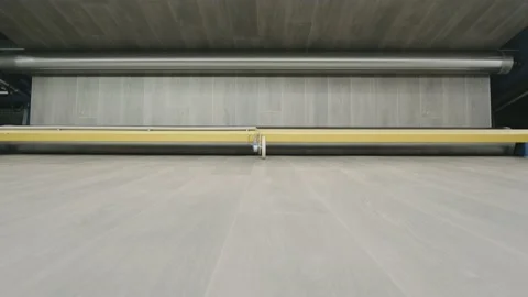 Linoleum technology production. Application of PVC-layer on the linoleum. 動画素材 130924323