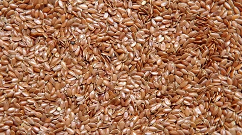 Linseed are spinning on a table. Stock Footage 35366115