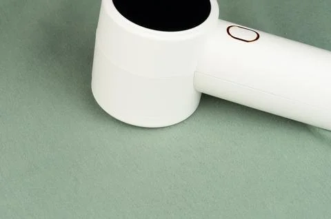 Lint remover tool work to clean textile surface Stock Photos