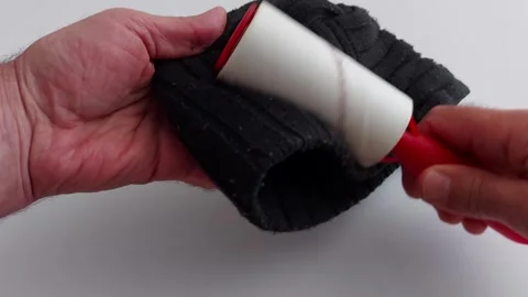 Lint Roller in Action: Flawless Fabric Care Video stock 309912304