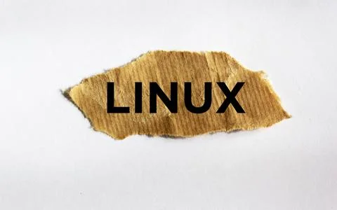 Linux. text on brown torn paper isolated on white background. 스톡 사진