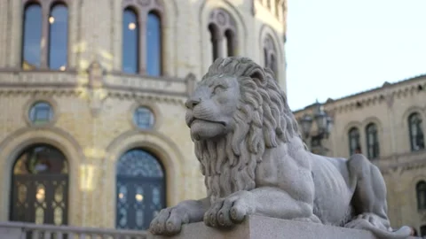 A lion statue outside The Storting Norwegian Parliament located in the 動画素材 221660094