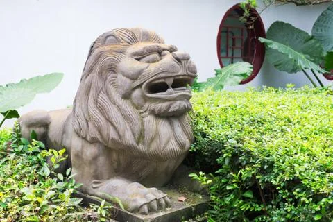 Lion stone statue in a park Stock-Fotos