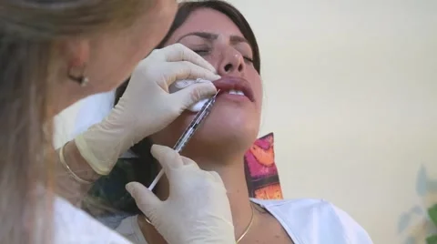 Lip augmentation Silicone injection young woman's lips Vidéo 63030236