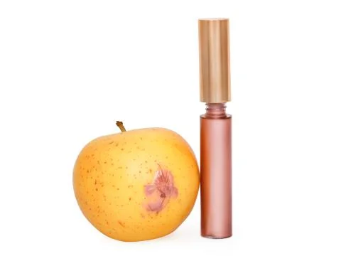 Lip gloss applied to the apple 写真素材