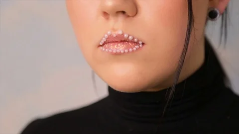 Lip makeup with beads.full hd video Stock Footage 85323501