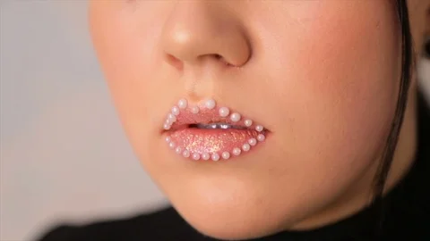Lip makeup with beads.full hd video Stock-Footage 85323811