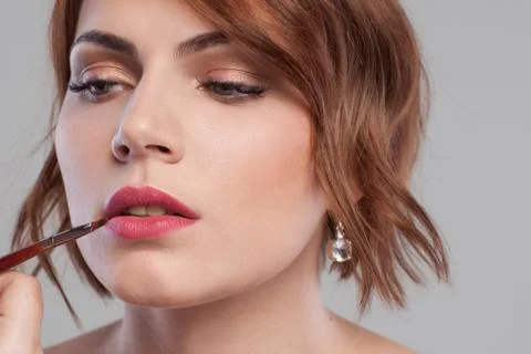 Lip makeup tutorial closeup. Women beauty Stock Photos