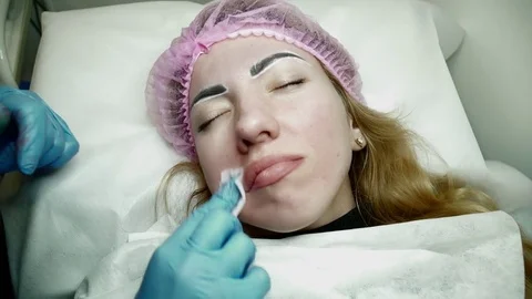 Lip permanent makeup procedure in a salon Stock Footage 74214866