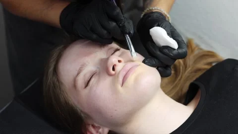 Lip skin preparation before permanent makeup using brush Stock Footage 316430066