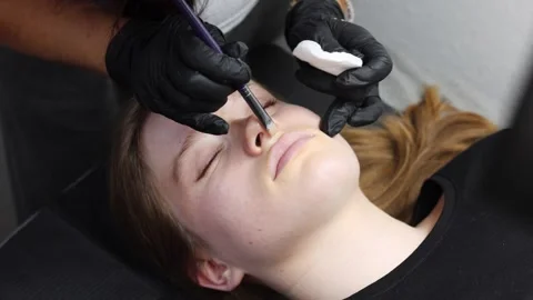 Lip tattoo process focusing on contour and symmetry Stock Footage 316430399
