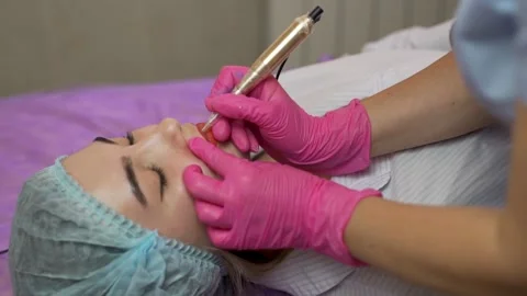 Lip Tattoo. Professional Worker Makes Lip Tattooing For Beautiful  Girl, Close-u Stock Footage 164289029