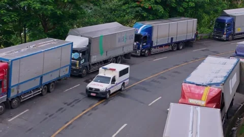 Lipata Philippines 2025/22/07 Delayed goods trucks Stock Footage 313525876