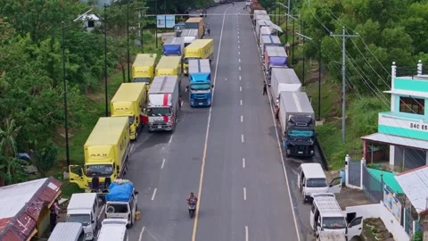 Lipata, Philippines, 2025/22/07 Stranded Freight Trucks Stock Footage 313525967