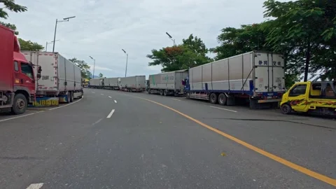 Lipata, Philippines, 2025/22/07 Stranded Freight Trucks Stock Footage 313526102