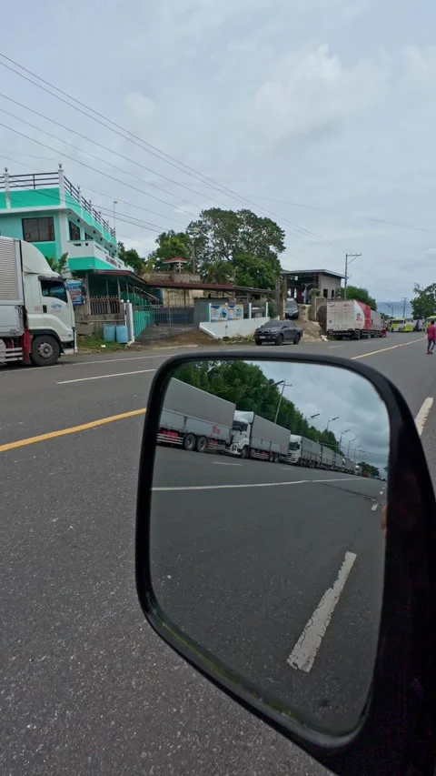 Lipata, Philippines, 2025/22/07 Stranded Goods Trucks Stock Footage 313526080