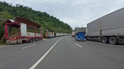 Lipata, Philippines 2025/22/07 Stranded Trucks at Port Stock Footage 313525930