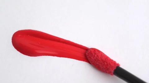 Lipgloss make-up smudge, smear. Classic red lipstick, lip gloss texture sme.. Stock Footage 265144302