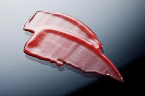 Lipgloss texture with black background Stock Photos