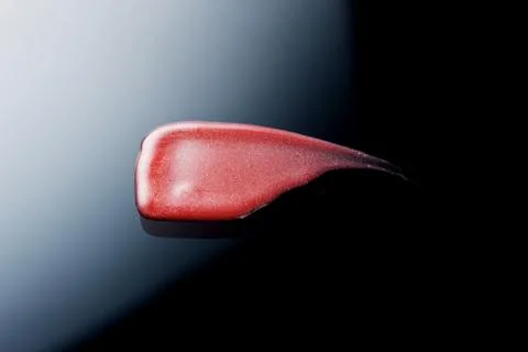 Lipgloss texture with black background Stock Photos
