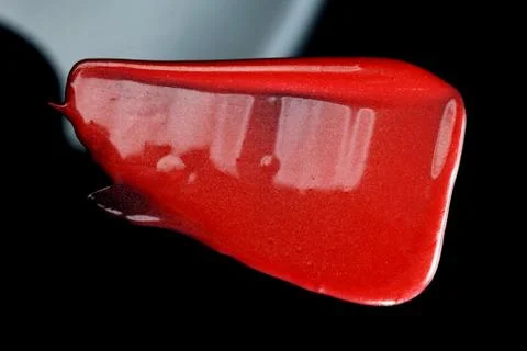 Lipgloss texture with black background Stock Photos