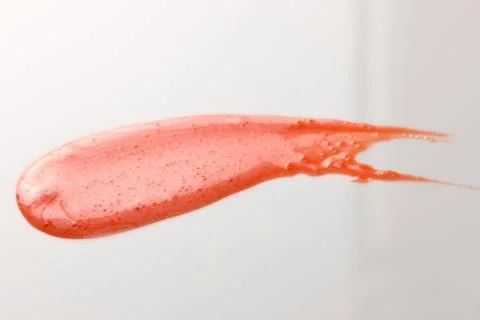 Lipgloss texture with white background Stock Photos