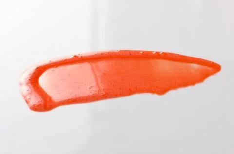 Lipgloss texture with white background Stock Photos