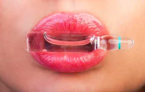 Lips and ampoule Stock Photos