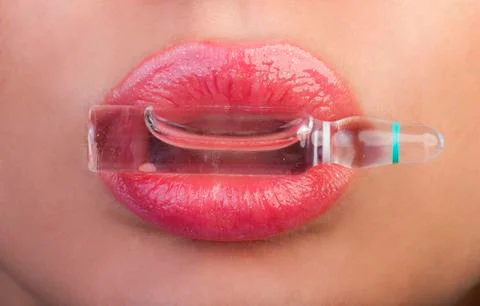 Lips and ampoule Stock Photos