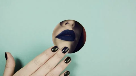 Lips of lilac color with peeping in a circular slot of colored paper. Stock Footage 86342753