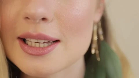 The lips of the model are painted with lipstick. Video stock 162472800