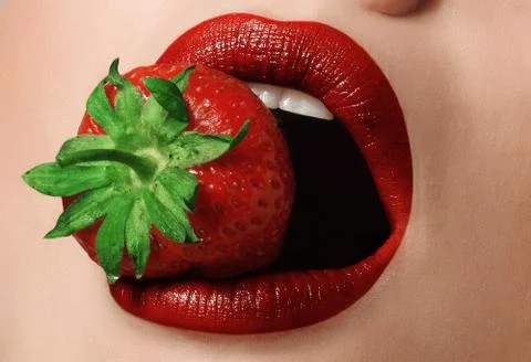 Lips with strawberry Stock Photos