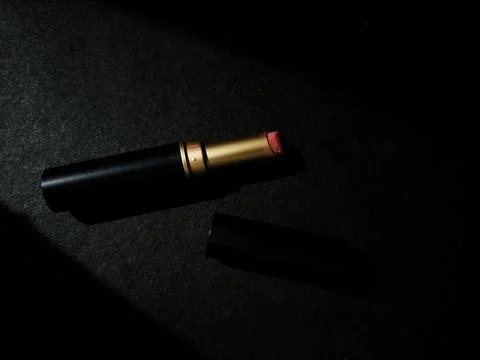 Lipstick on black background Stock Photos