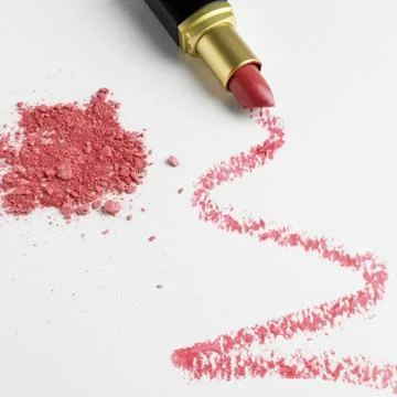 Lipstick zigzag pattern on white background with make up powder Stock Photos