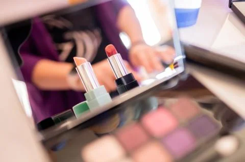 Lipsticks reflected in a make-up mirror Stock Photos