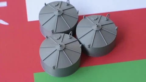 Liquefied gas storage tanks set against the Omani flag, representing the concept Stock Footage 344530237
