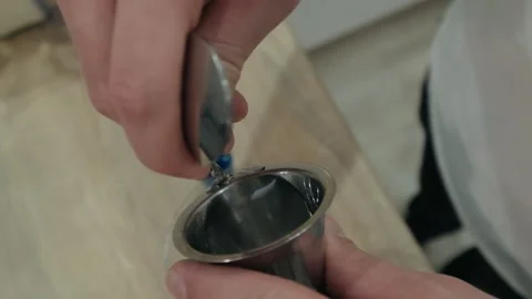 Liqueur flows over long cocktail spoon. Top view, slow motion Stock Footage 131543391