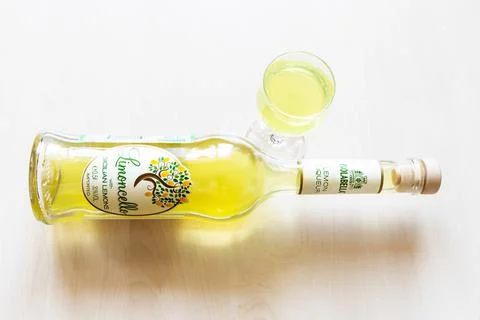 Liqueur glass and bottle of Isolabella Limoncello Stock Photos