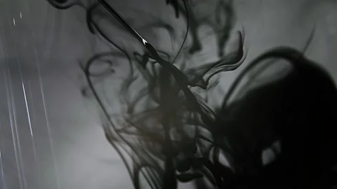 Liquid abstractions, the dissolution of blue paint in water, Slow motion, Video stock 172080727