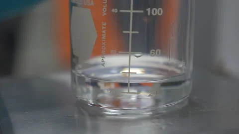 Liquid Added to Beaker Stock Footage 137282148
